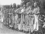 The Dahomey Amazons or Mino were a Fon all-female military regiment of the Kingdom of Dahomey (now Benin) which lasted until the end of the 19th century. The Mino were recruited from among the ahosi ('king's wives') of which there were often hundreds. Some women in Fon society became ahosi voluntarily, while others were involuntarily enrolled if their husbands or fathers complained to the King about their behaviour. Membership among the Mino was supposed to hone any aggressive character traits for the purpose of war. During their membership they were not allowed to have children or be part of married life. Many of them were virgins. The regiment had a semi-sacred status, which was intertwined with the Fon religious beliefs. The Mino trained with intense physical exercise. Discipline was emphasised. In the latter period, they were armed with Winchester rifles, clubs and knives. Units were under female command. Captives who fell into the hands of the Amazons were often decapitated.