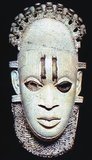 Nigeria: An ivory pendant mask depicting the iyoba (queen mother) Idia (16th century), Benin Empire, 16th century.<br/><br/>

Idia was the mother of Esigie (r. 1504-1550), the Oba (king) of the Benin Empire. She played a critical part in the rise and reign of her son, being described as a great warrior who fought tirelessly before and during her son's rule.<br/><br/>

The Kingdom of Benin, also called the Edo Kingdom and the Benin Empire, was a kingdom in West Africa in what is now southern Nigeria; it is not to be confused with the modern nation of Benin. The Kingdom of Benin's capital was Edo, now known as Benin City in Nigeria's Edo state. The Benin Kingdom was 'one of the oldest and most highly developed states in the coastal hinterland of West Africa', and was formed around the 11th century CE, lasting until its annexation by the British Empire in 1897.