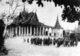 Cambodia: Buddhist monks of the Dhammayutikanikay order gather in front of the Silver Pagoda in Phnom Penh in 1924.