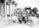 Cambodia: The crowning ceremony of HM Sisowath Monivong at the Royal Palace in Phnom Penh on 24 July, 1928. He is carried on a sedan while Brahmin attendants line up holding conches.