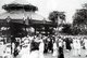 Vietnam: A crowd gathers at the bandstand near City Hall, Hanoi (early 20th century).